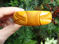 Vintage Goldenrod Bakelite Bracelet: Abstract Carved Design