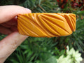 Vintage Goldenrod Bakelite Bracelet: Carved Leaf Design