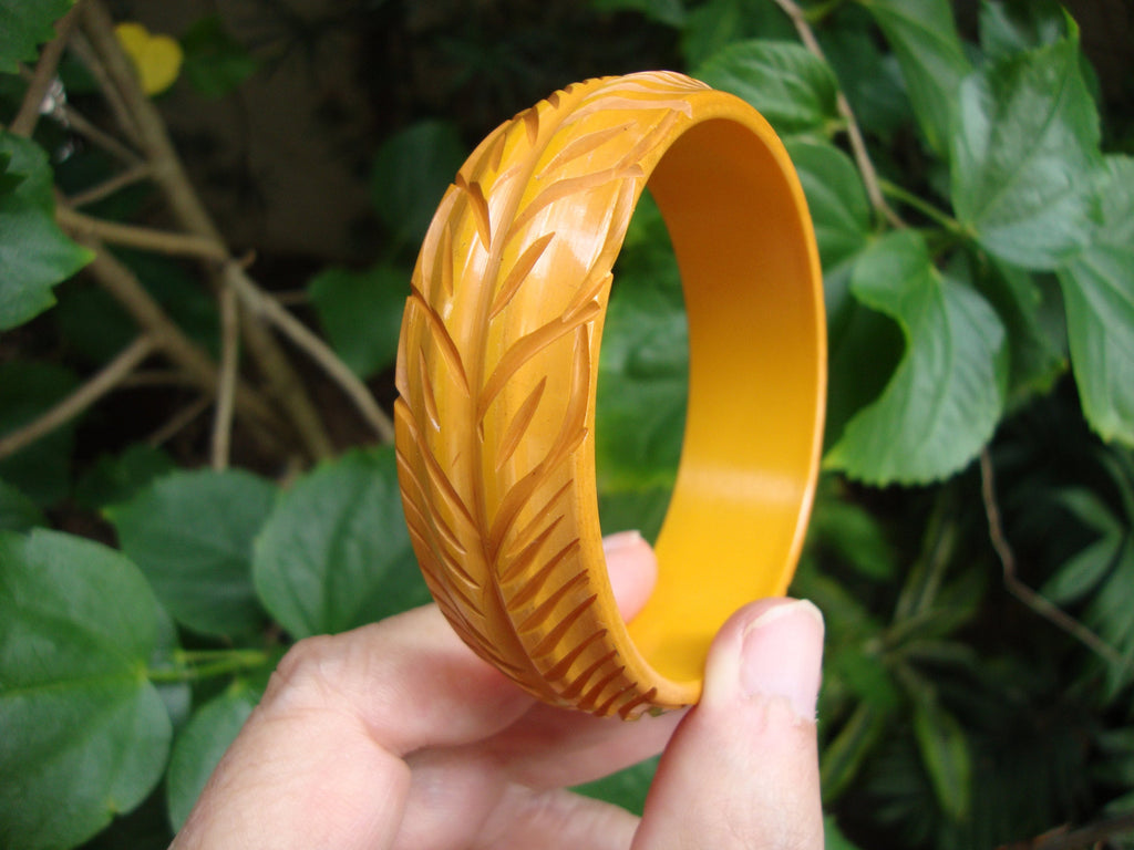 Vintage Goldenrod Bakelite Bracelet: Carved Vine & Leaf Design