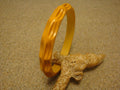 Vintage Goldenrod Bakelite Bracelet: Carved Thumbprint Design
