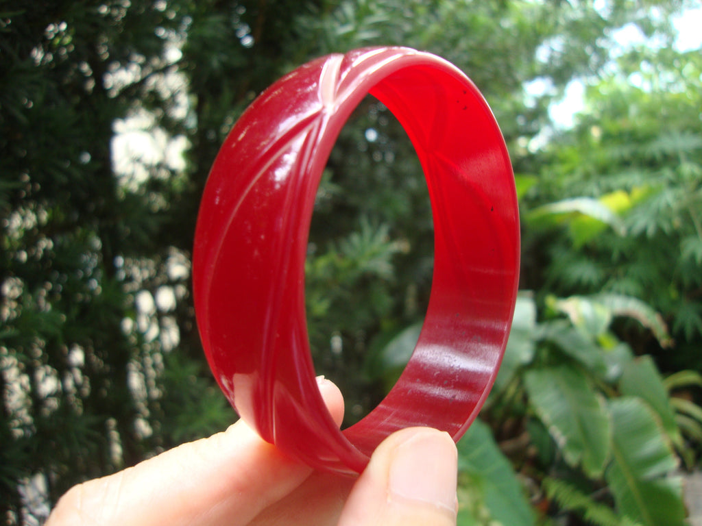 Vintage Ruby Red Bakelite Bracelet: Abstract Flower Carvings